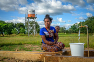 a women in africa getting water